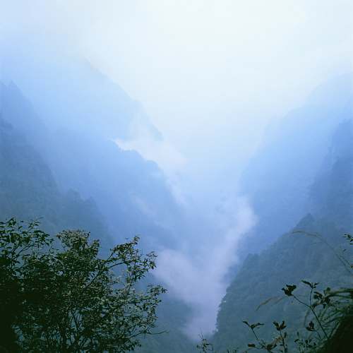 outdoors landscape photo of a foggy valley blue