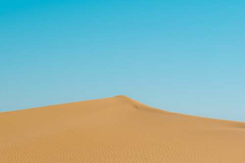 outdoors photo of brown sand dunes soil