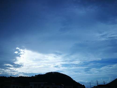 outdoors silhouette on mountain under blue ksy weather