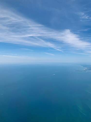blue aerial photography of blue sea land