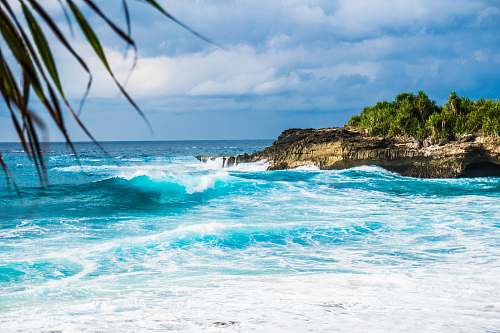 beach ocean waves rushing trough stones waves