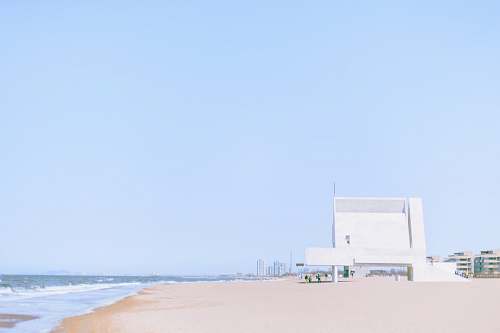 blue white building by the sea nature