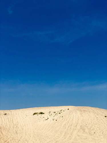 nature white mountain under blue sky close-up photography soil