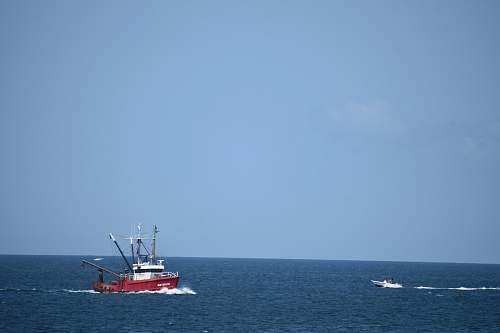 vehicle red boat on sea boat