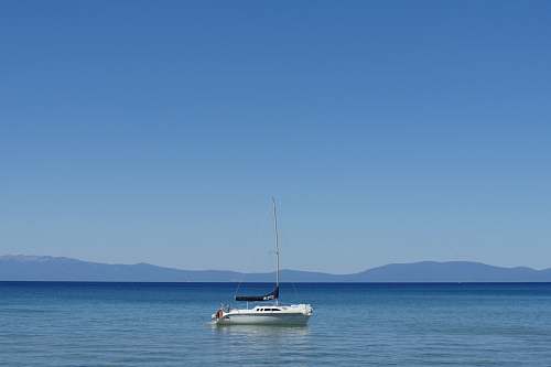 boat sail boat on body of water during daytime vehicle