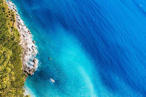 nature aerial photography of body of water coast