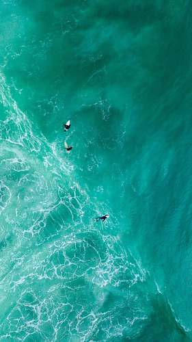 nature aerial photography of surfers on sea outdoors