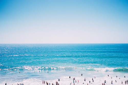 ocean bird's eye view of people on sea beach
