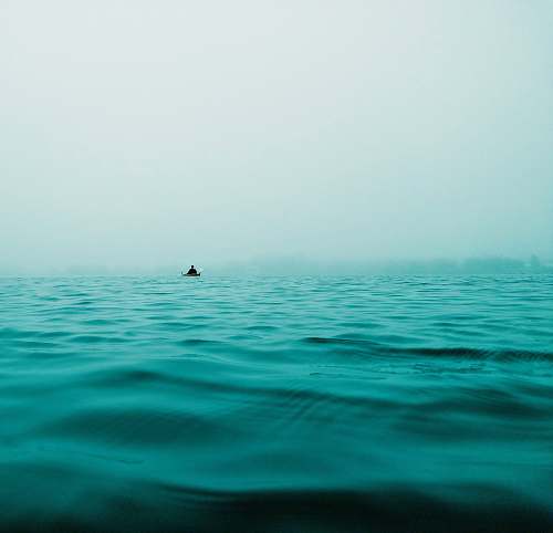 ocean closeup photo of calm body of water horizon