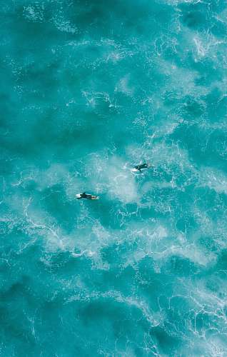 ocean two people surfing on water sea