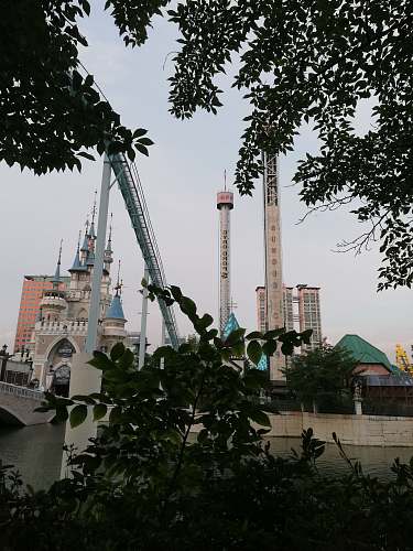 architecture grey and brown concrete buildings during daytime spire