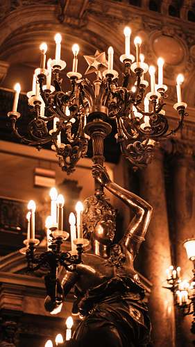 paris woman holding candelabra statue game