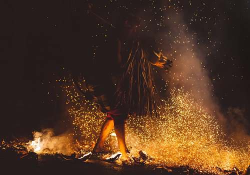 night person walking of fire flame