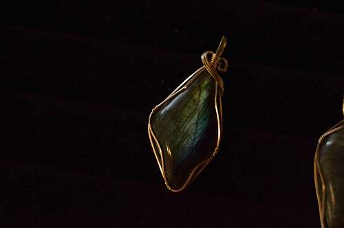 jewelry green gemstone wire wrap pendant with black background jewellery