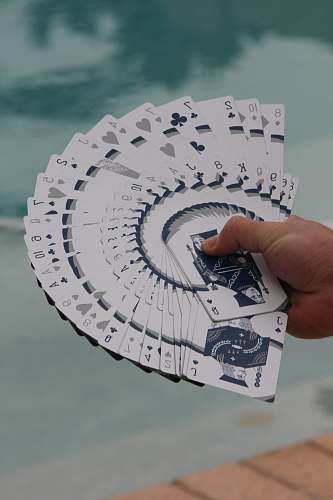 az playing cards on person's hand usa