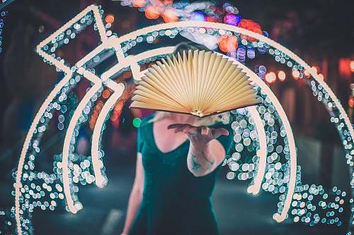 person person showing white folding fan crowd