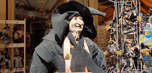 apparel witch mascot near store clothing