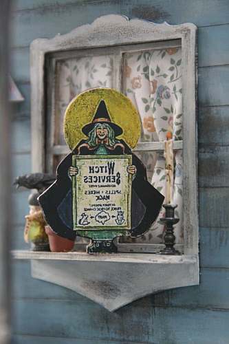 person witch services signage on window shelf symbol