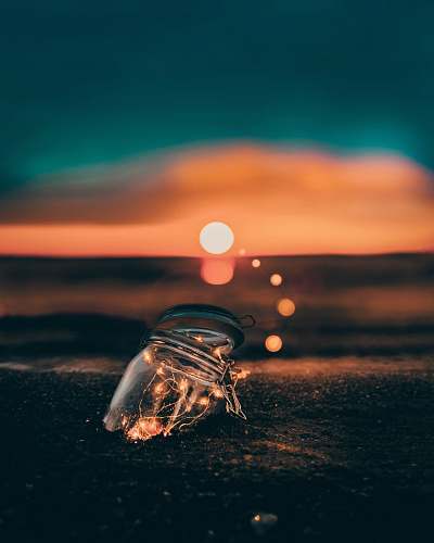 toronto clear glass jar on sand fairy light