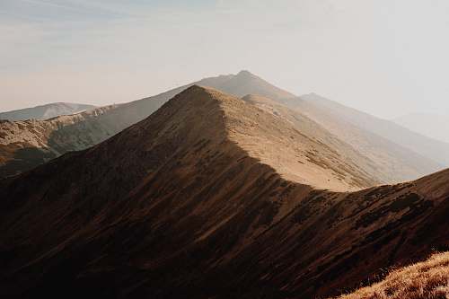 outdoors brown mountain during daytime soil