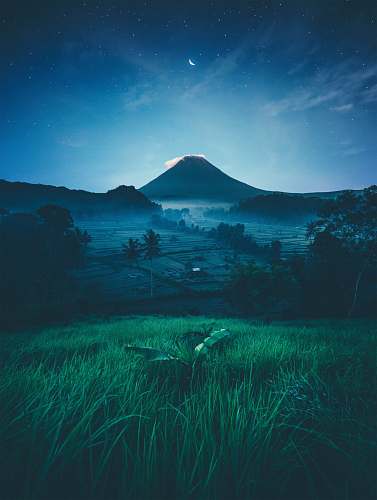 bali mountain near green trees at night indonesia