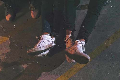 human two persons wearing high-top sneakers person