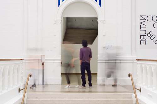 human man standing on door people
