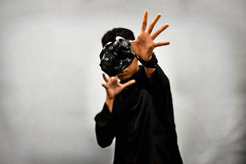 human man wearing black shirt with virtual reality headset people