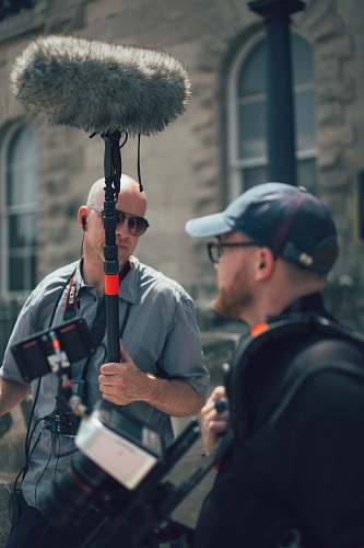 human men getting ready to shoot a movie film people