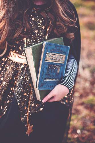 people person holding two books human