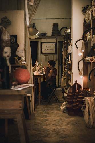 human person sitting in front of table restaurant