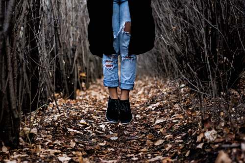 people person standing on dried leaves human