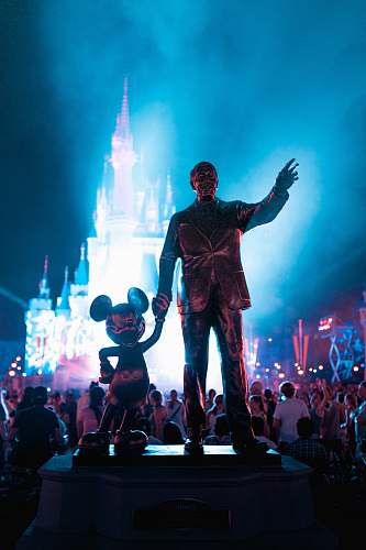 people Walt Disney and Mickey Mouse statue during daytime human