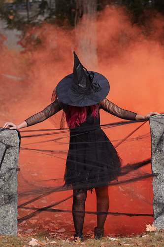 apparel witch holding two black post clothing