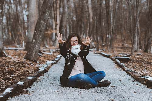 human woman sitting near trees people
