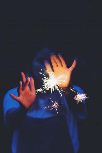 human woman with a sparkler finger