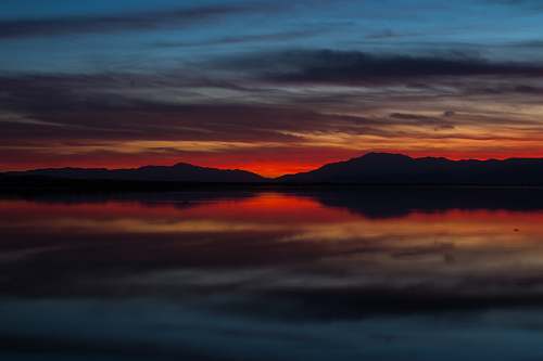 nature landscape photography of island surrounded by fog during golden hour sky