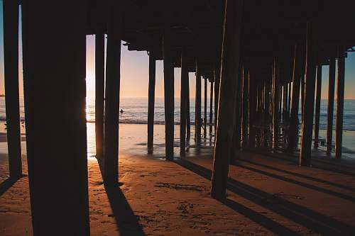 pier silhouette photo of sea dock dock