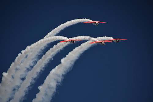 airplane four red planes with contrails biplane