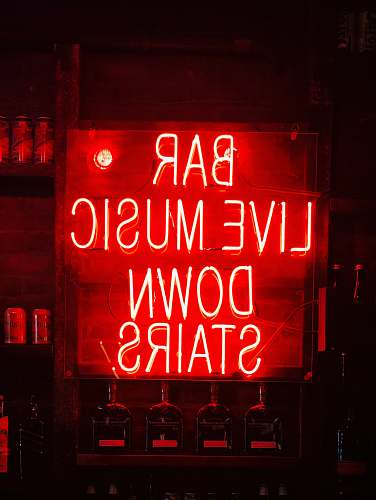 liquor bar live music down stairs neon light signage drink