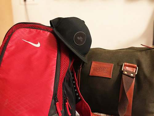 clothing black cap on duffle bags bag