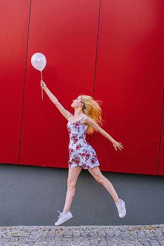 clothing woman holding white balloon person