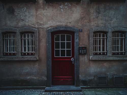 building red wooden half-glass closed door door