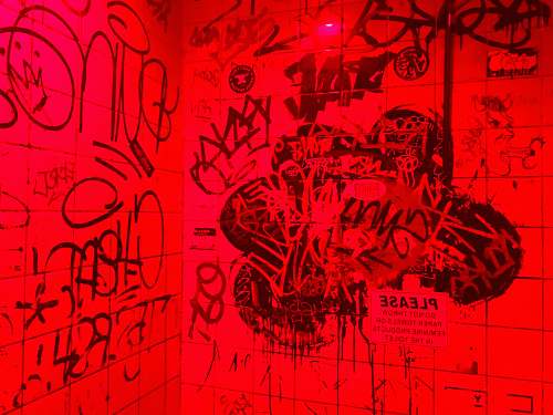 text red surface bathroom in the bar
