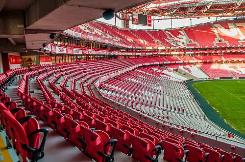 hall white and red stadium photo at daytime indoors