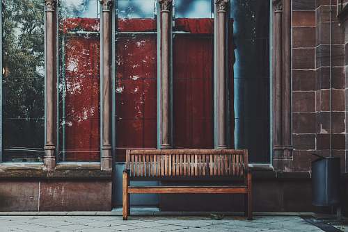 germany empty brown wooden bench near shop window