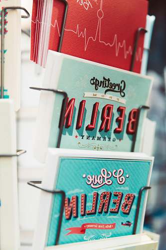 germany shallow focus photography of greeting cards on rack card