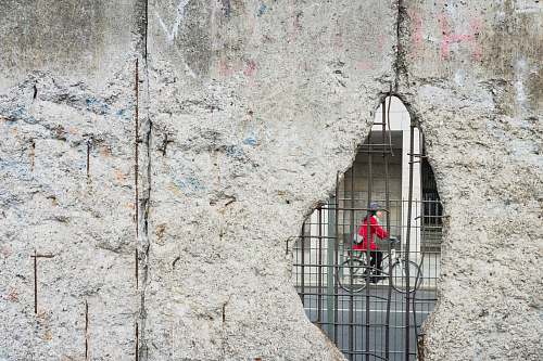 germany woman riding bicycle hole