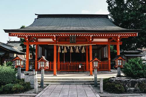 temple orange and black wooden temple during day architecture