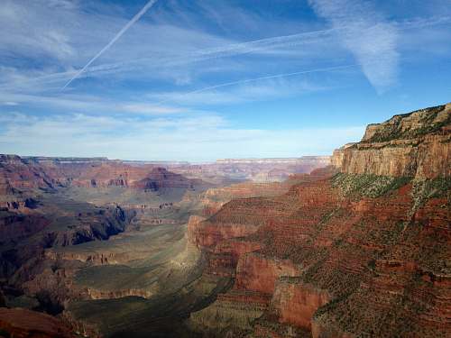 mountain mountains under blue cloudy skies valley